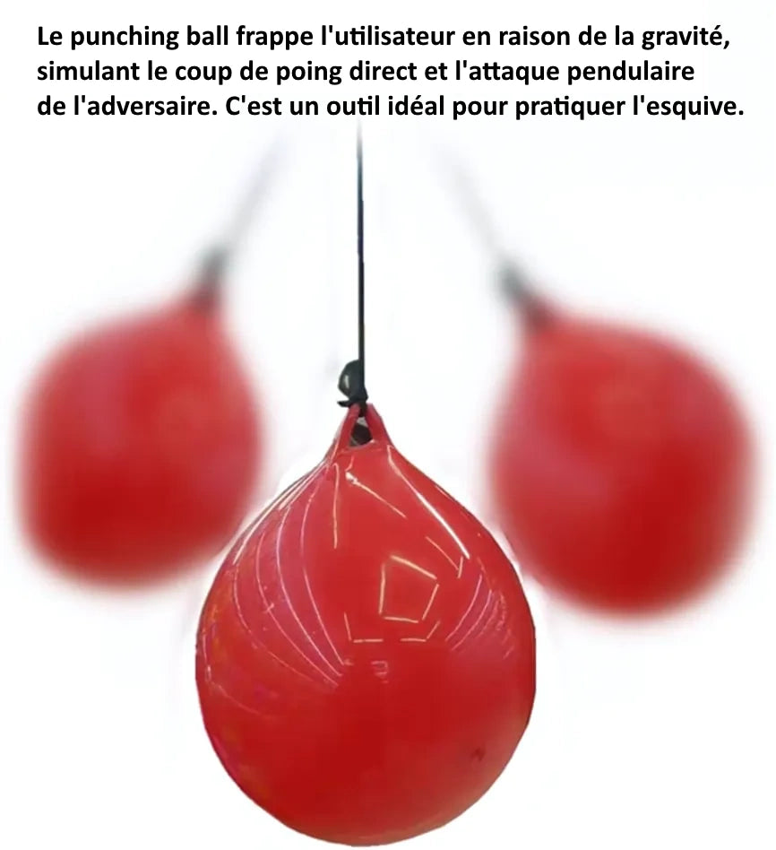 Punching ball rouge en mouvement, illustrant l'usage pour la pratique de l'esquive.
