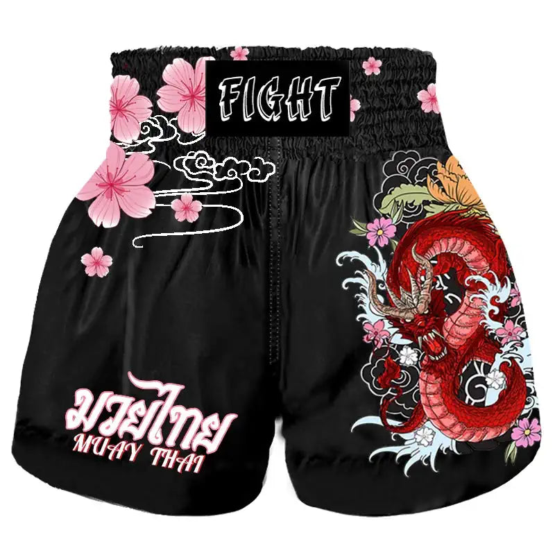 Short de boxe thaï noir avec motifs rose et dragon pour femme, vue avant.